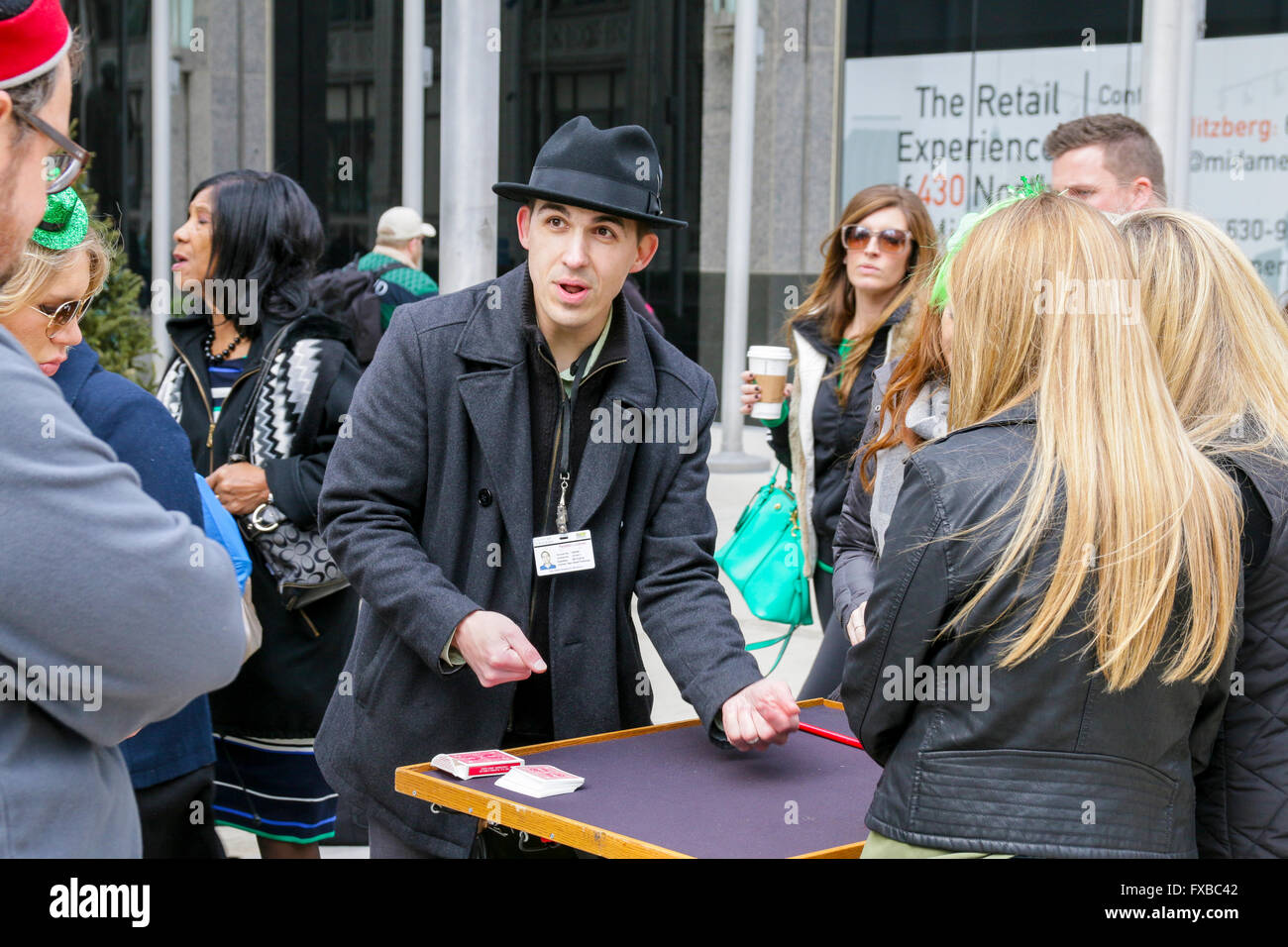 Street performer/magician doing card trick. Chicago, Illinois. Stock Photo