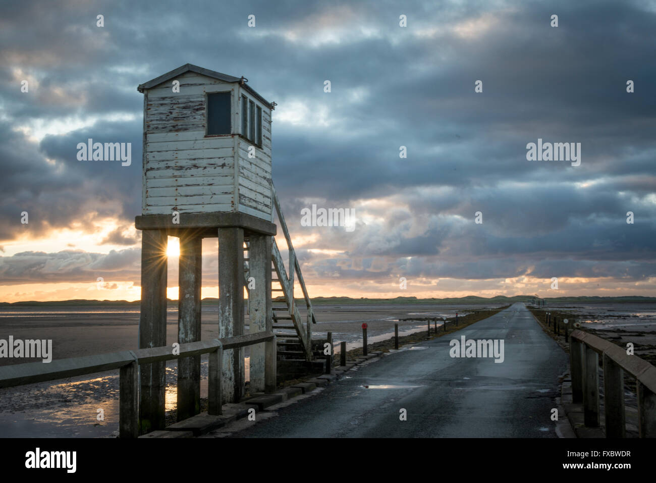 The causeway from the mainland to Lindisfarne island Stock Photo