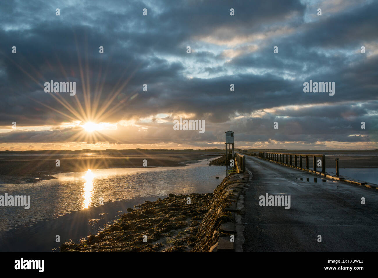 The causeway from the mainland to Lindisfarne island Stock Photo