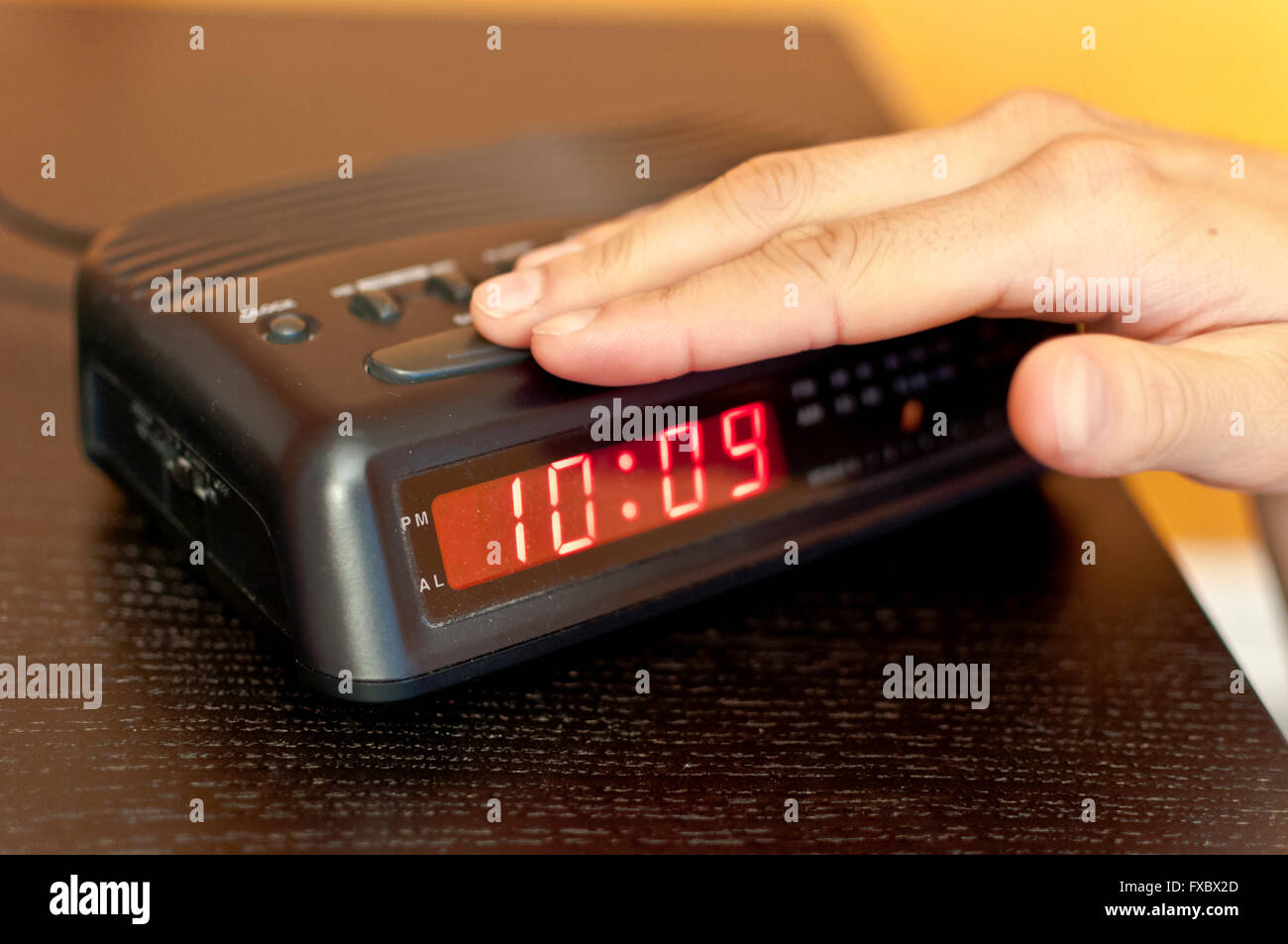 Snoozing the morning alarm Stock Photo Alamy