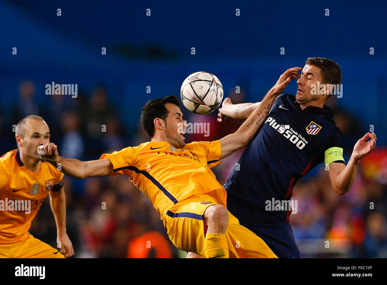 Madrid, Spain. 13th Apr, 2016. Sergio Busquets i Burgos (5) FC Barcelona and Grabiel Fenandez Arenas (14) Atletico de Madrid. UCL Champions League between Atletico de Madrid and FC Barcelona at the Vicente Calderon stadium in Madrid, Spain, April 13, 2016 . © Action Plus Sports/Alamy Live News Stock Photo