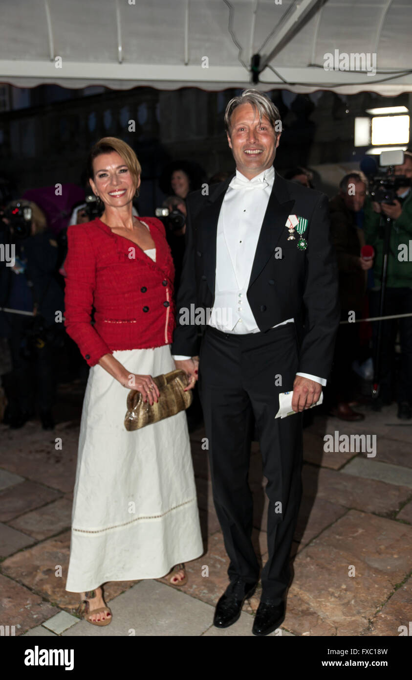 Fredensborg, Denmark, April 13th, 2016. Famous actor (' Le Chiffre' in James Bond Casino Royale), Mads Mikkelsen and wife  Hanne Jacobsen arrive to the royal Fredensborg Palace, where Danish Queen Margrethe host a State Banquet on the occasion of the Mexican President’s, Enrique Peña Nieto, two days State Visit to Denmark. The visit began today Wednesday and follows the Danish Queen’s visit to Mexico in 2008 and the Crown Prince’s visit in 2013. Credit:  OJPHOTOS/Alamy Live News Stock Photo