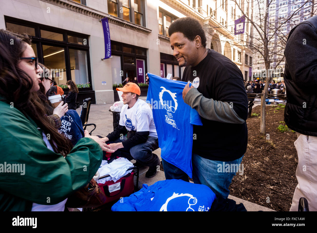 New York, USA. 13th April, 2016. Hours before a Bernie Sanders rally is scheduled to begin, supporters sell campaign buttons and t-shirts in Schwartz Plaza near Washington Square Park. Over 10,000 people are expected to attend the rally for the Democratic Presidential Candidate. Credit: Stacy Walsh Rosenstock/Alamy Live News Stock Photo
