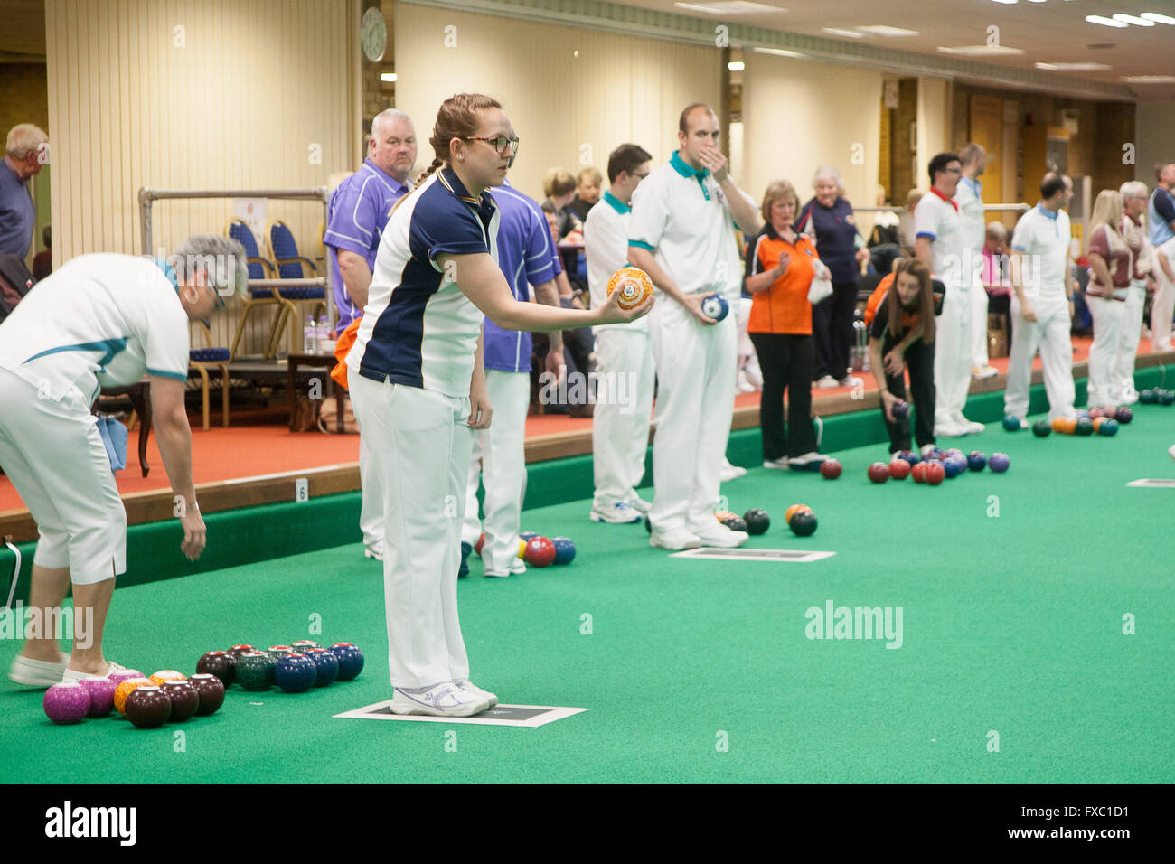 Melton Mowbray, Leicestershire,UK. 13th April 2016. English Indoor Bowling Association National Championships held at Melton and District Indoor Bowls Club. The quarter finals of the ladies and mens Nationa triples teams being played out. Credit:  Jim Harrison/Alamy Live News Stock Photo