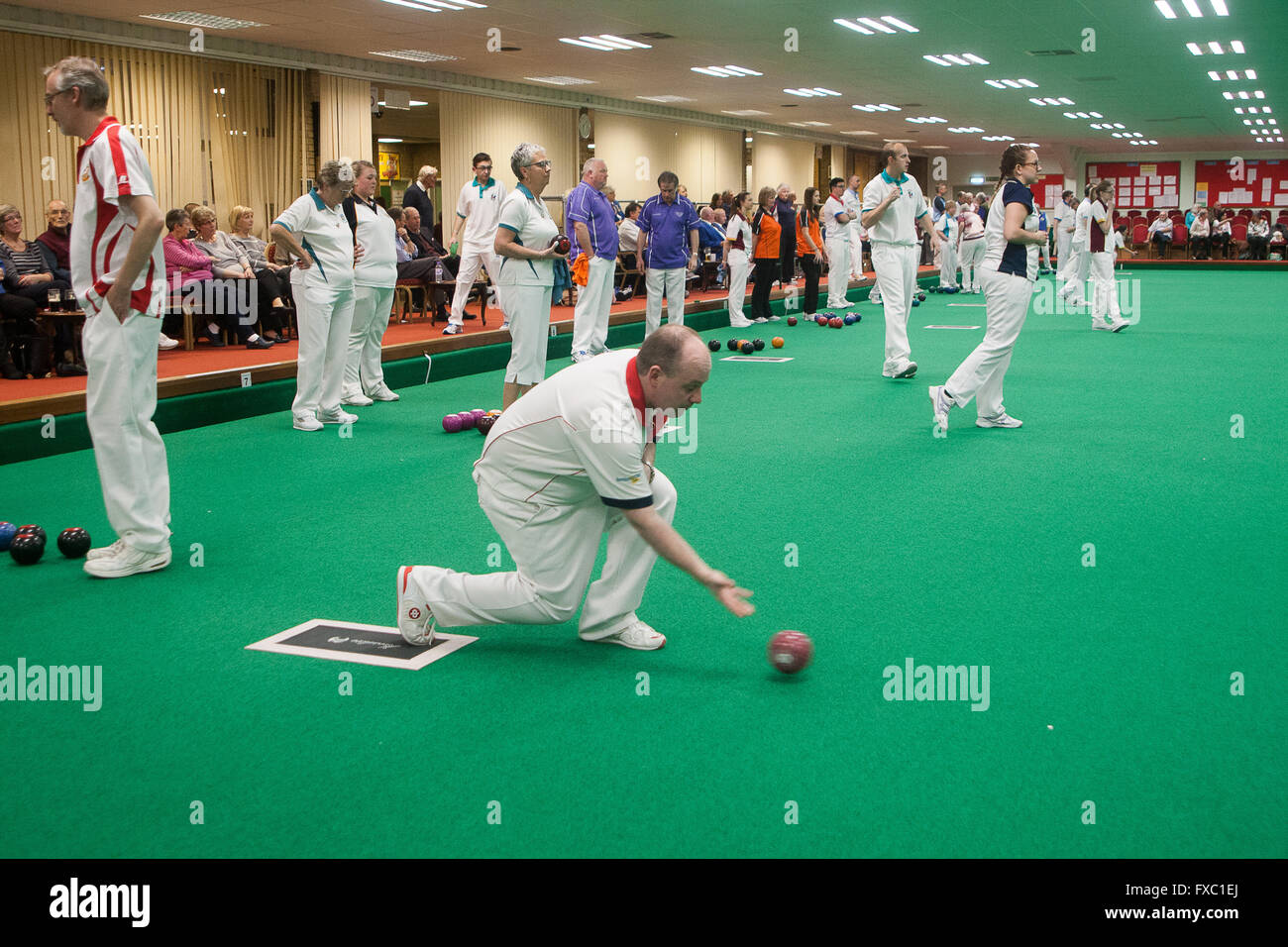 Melton Mowbray, Leicestershire,UK. 13th April 2016. English Indoor Bowling Association National Championships held at Melton and District Indoor Bowls Club. The quarter finals of the ladies and mens Nationa triples teams being played out. Credit:  Jim Harrison/Alamy Live News Stock Photo