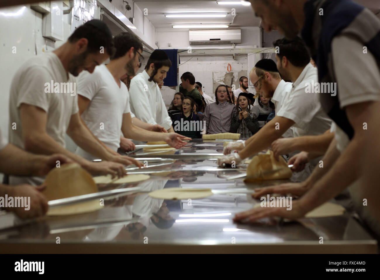 Jerusalem. 22nd Apr, 2016. Jewish boys watch the baking of the Matzoth (unleavened bread) during the preparations for the upcoming Jewish Pesach (Passover) holiday on April 13, 2016 in Bnei Brak, near the city of Tel Aviv. Pesach, which will be marked on April 22, 2016, commemorates the Israelites' exodus from slavery in Egypt some 3,500 years ago and their plight by refraining from eating leavened food products. © Gil Cohen Magen/Xinhua/Alamy Live News Stock Photo