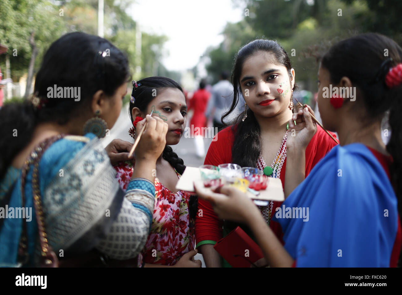 Dhaka, Bangladesh. 14th Apr, 2016. A young Bangladeshi girl gets face