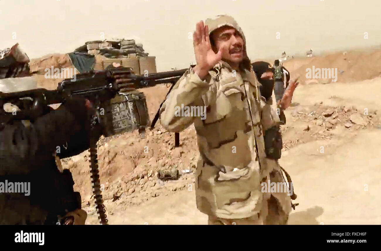 Undated propaganda video capture released by the Islamic State of Iraq and the Levant showing an Iraqi army officer led away to be executed after being captured during fighting in Anbar Province, Iraq. Stock Photo