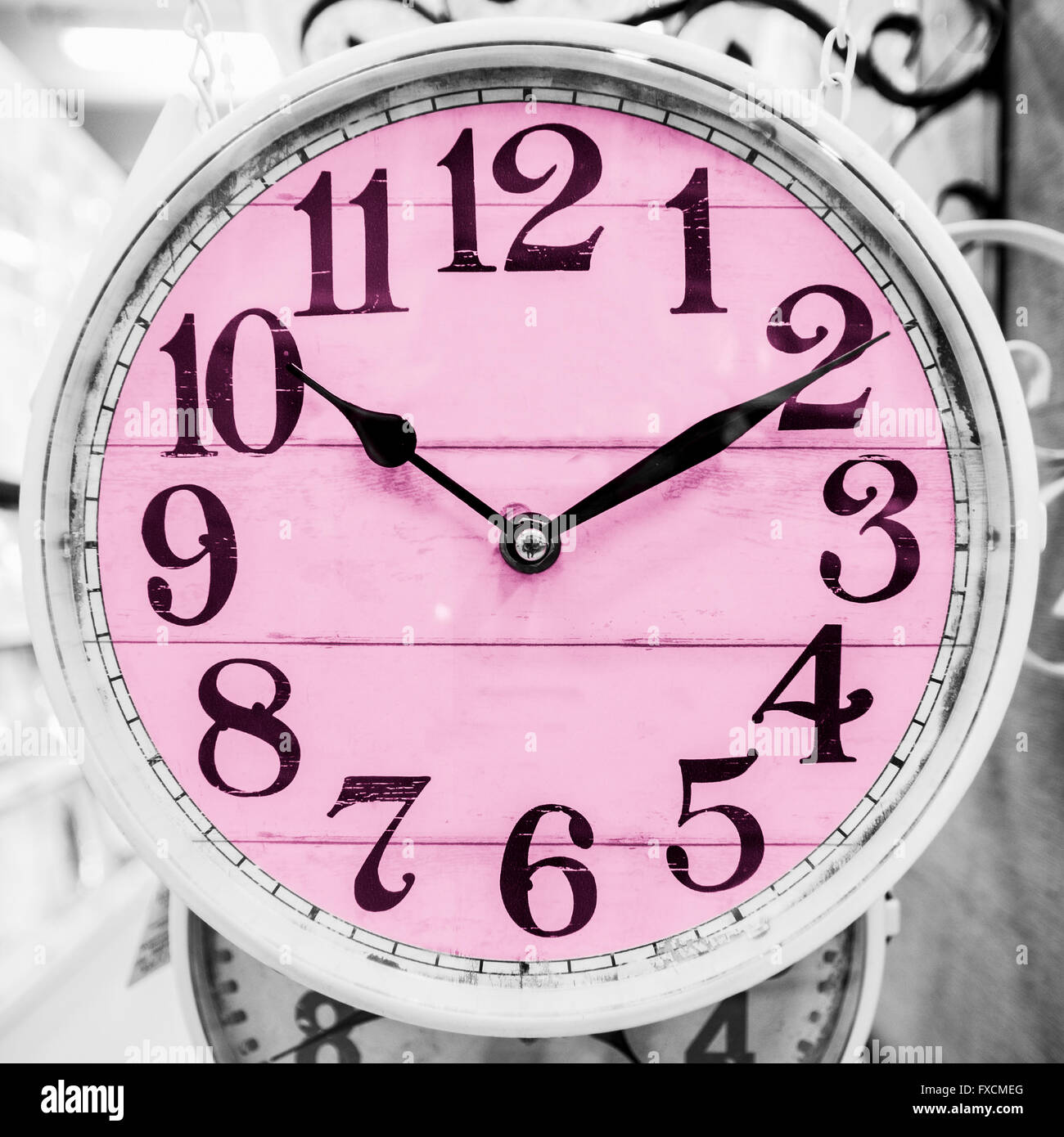 Detail of pink clock in a classical style. Stock Photo
