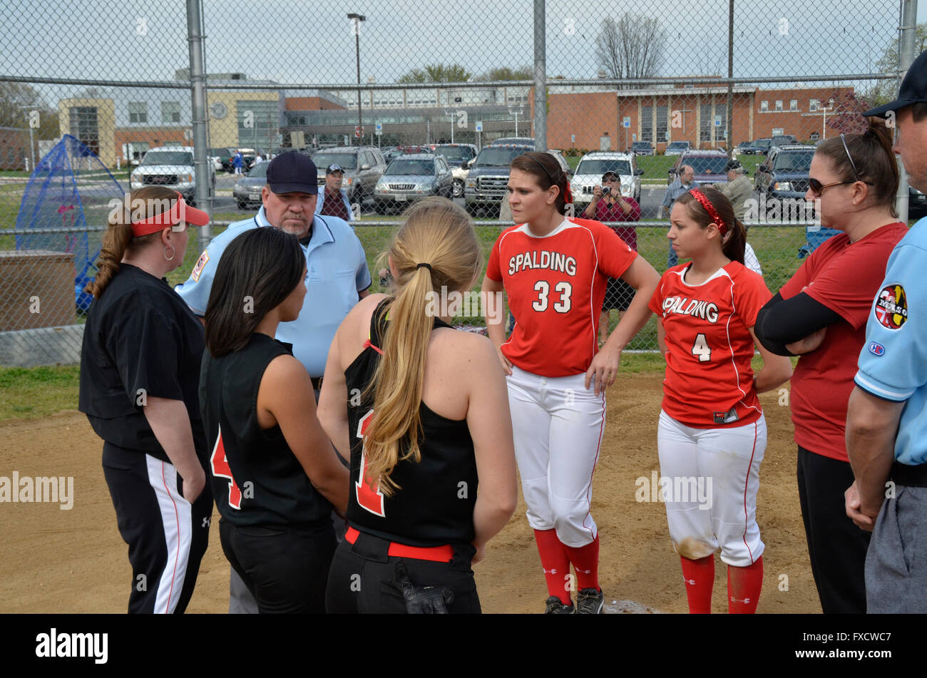team captains, coaches and umpires greet each other at the beginning of