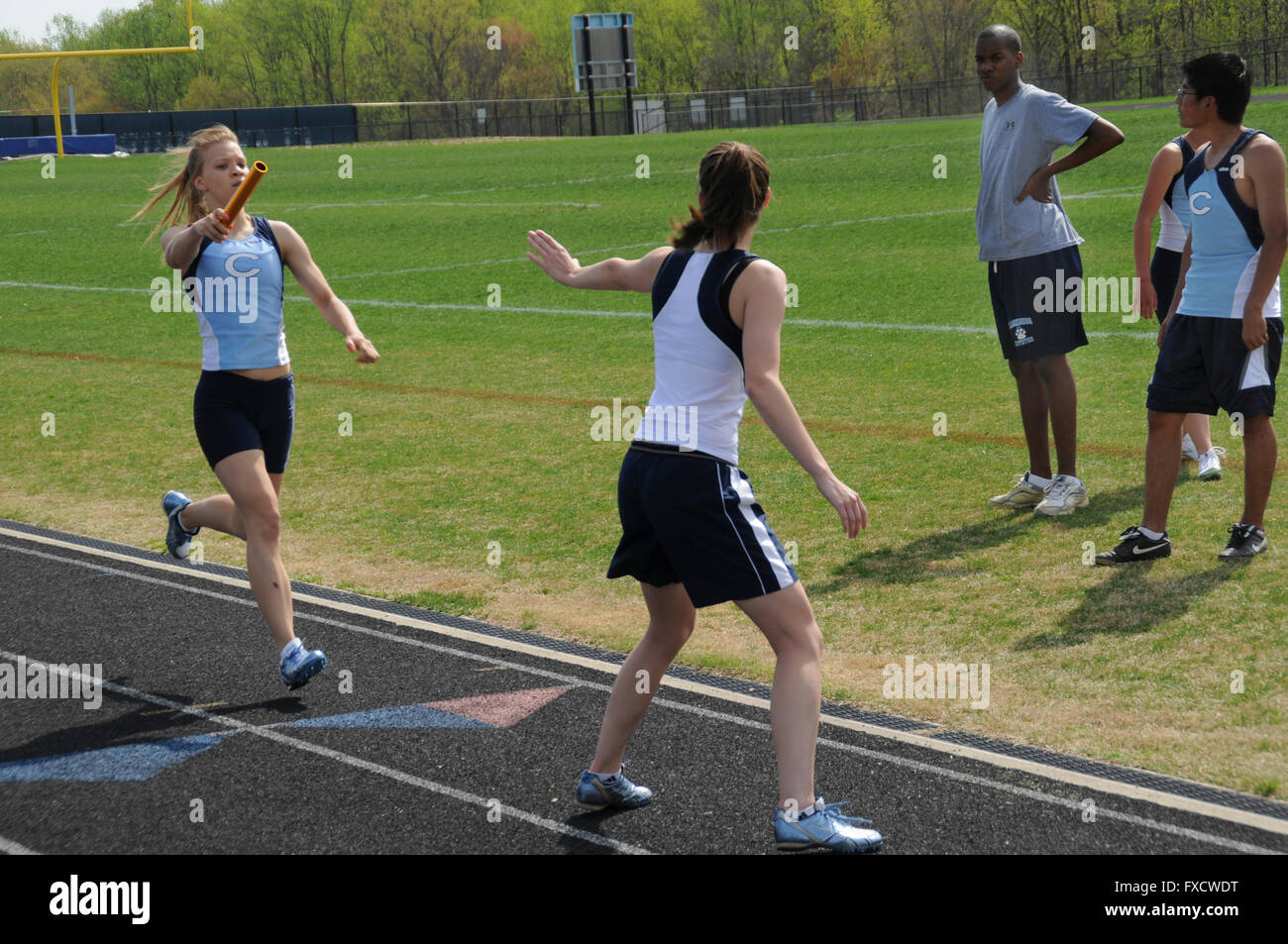 Girl's high school relay race Stock Photo Alamy