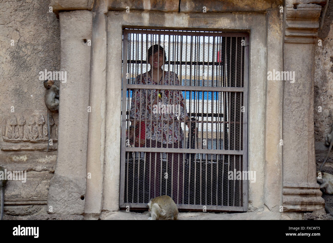 Thai women travel and portrait in ancient and ruins building Phra Prang Sam Yod in Lopburi, Thailand Stock Photo