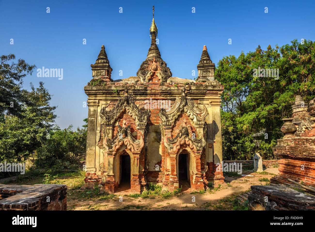 One of many ruined temples in the ancient city and former 14th to 19th century capital of Ava, also called Inwa. Stock Photo
