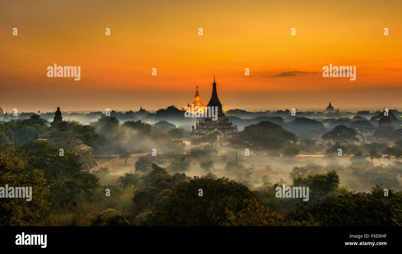 Scenic sunrise above Bagan in Myanmar. Bagan is an ancient city with thousands of historic buddhist temples and stupas. Stock Photo