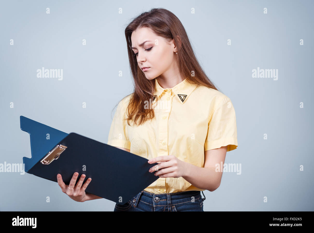 Young beautiful woman with folder Stock Photo