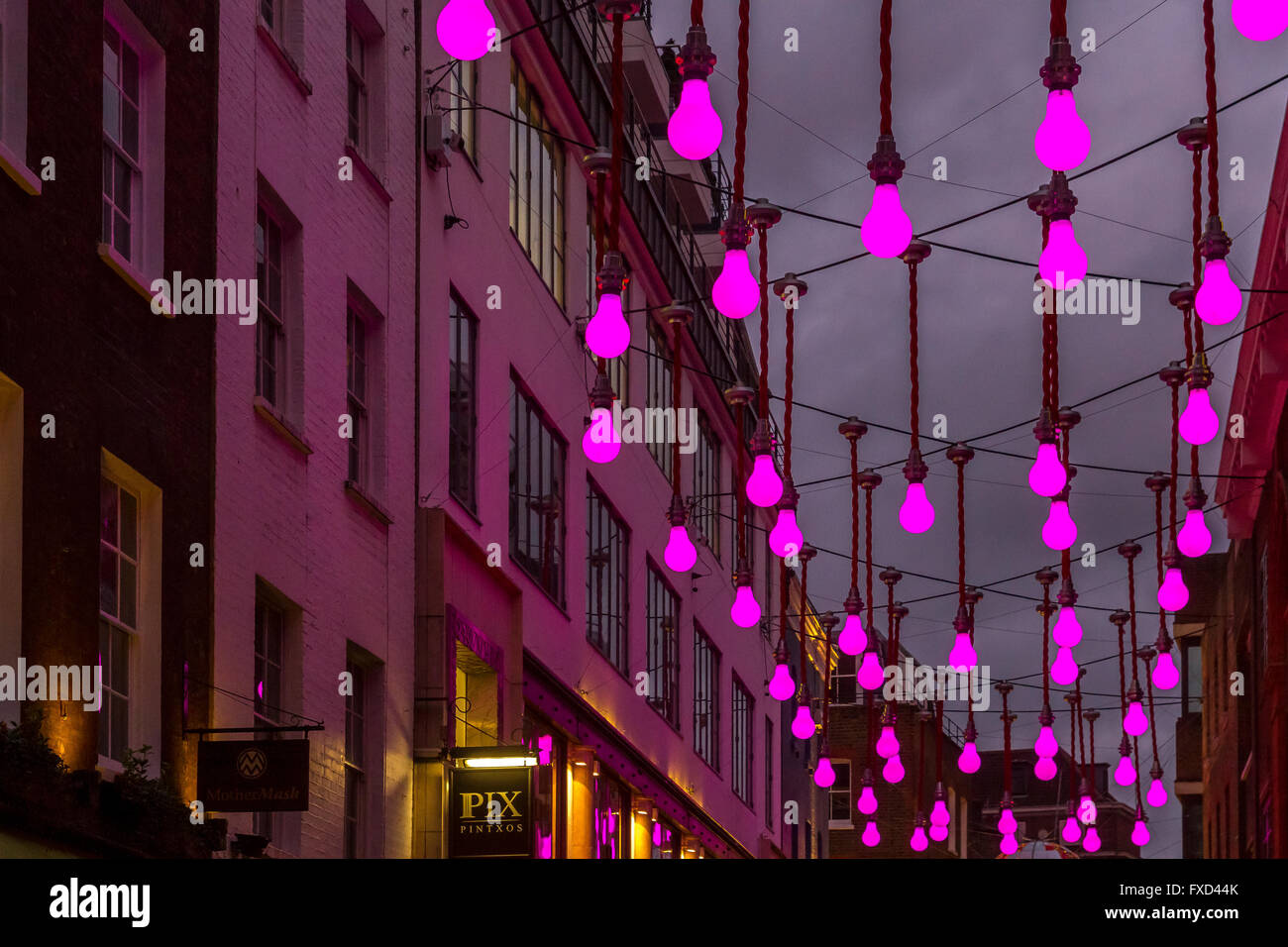 London Christmas Lights Festiv Giant Purple Light Bulbs Hanging Above Ganton St Soho London Uk London Christmas Lights Festiv Giant Purple Light Bulbs Hanging Above Ganton St Soho London Uk