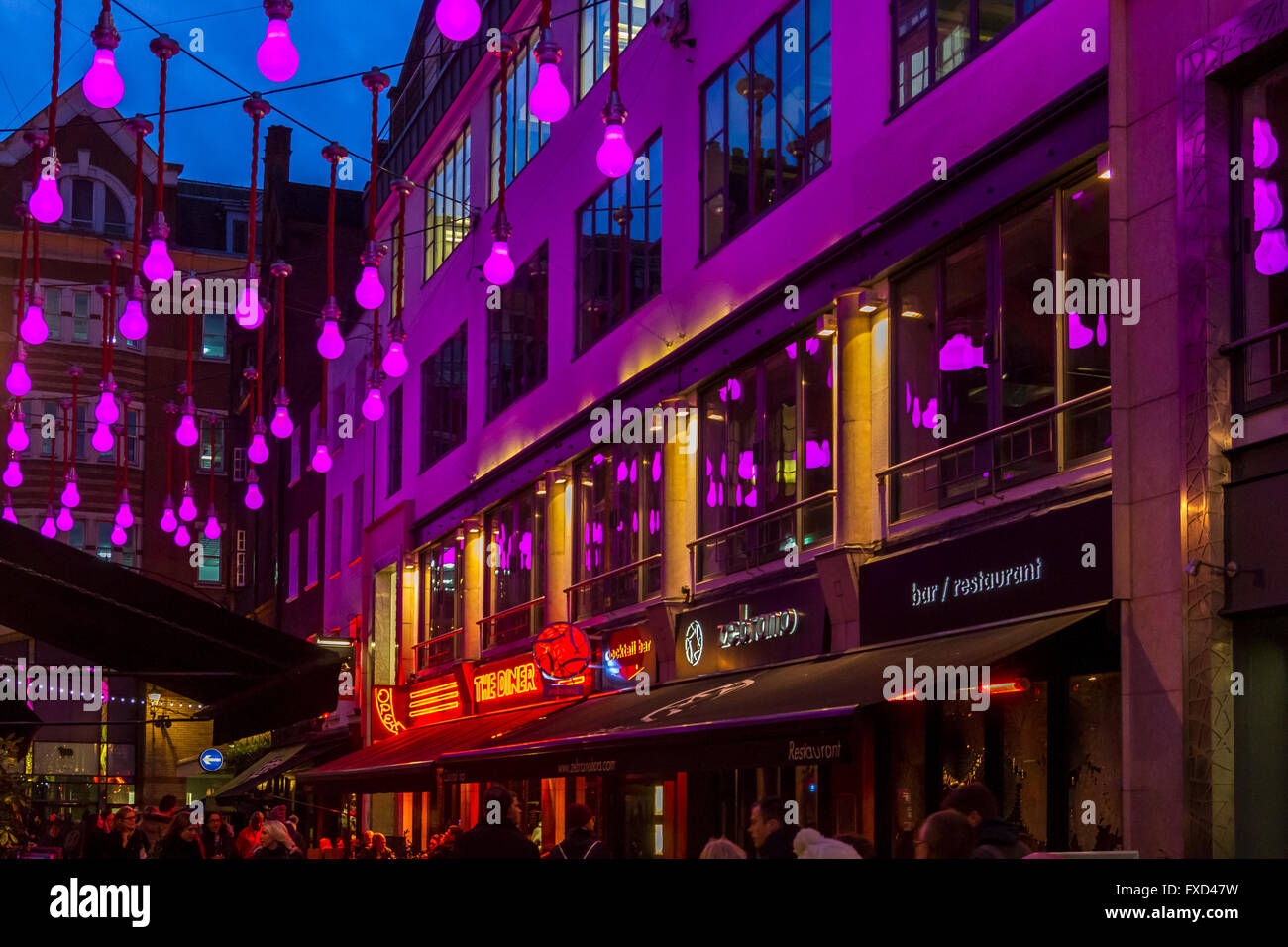 London Christmas Lights Festiv Giant Purple Light Bulbs Hanging Above Ganton St Soho London Uk London Christmas Lights Festiv Giant Purple Light Bulbs Hanging Above Ganton St Soho London Uk