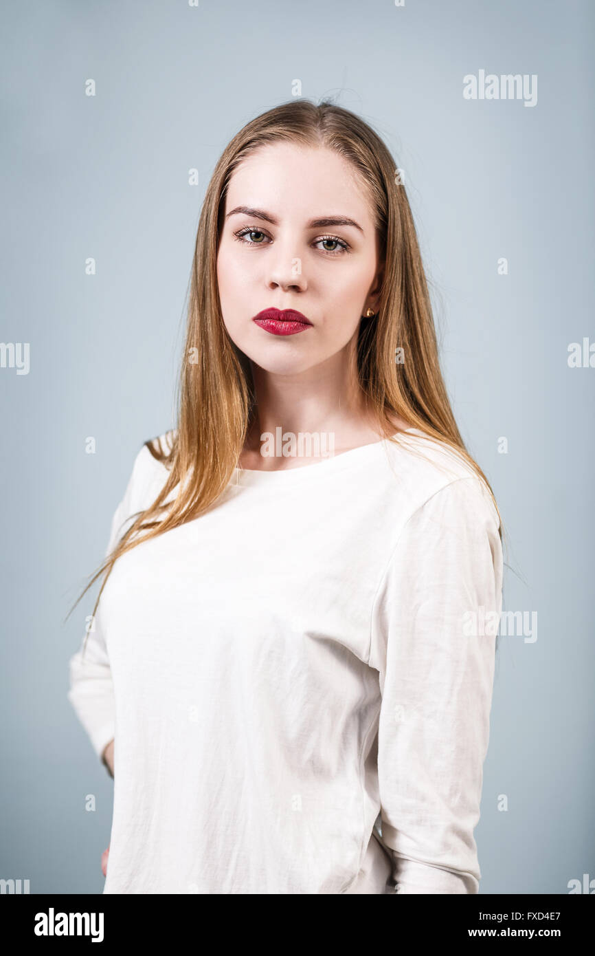 Young beautiful woman with serious face Stock Photo