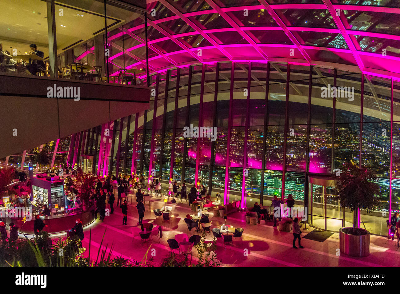 People at the  he Sky Pod Bar at night at the top of 20 Fenchurch St, also known as the Walkie Talkie Building, London, UK Stock Photo