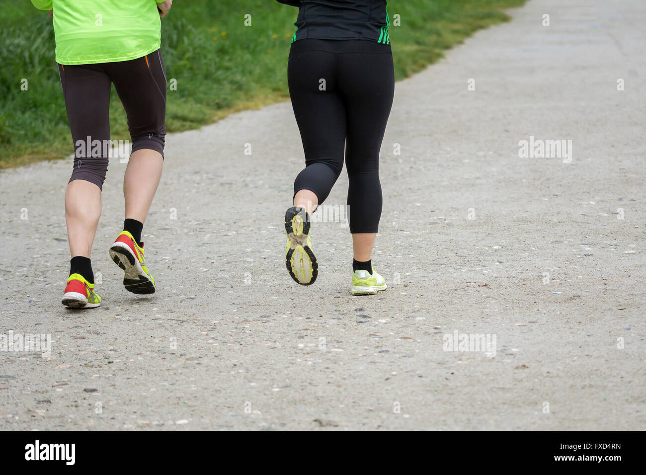 Young couple running outdoors in nature Stock Photo - Alamy