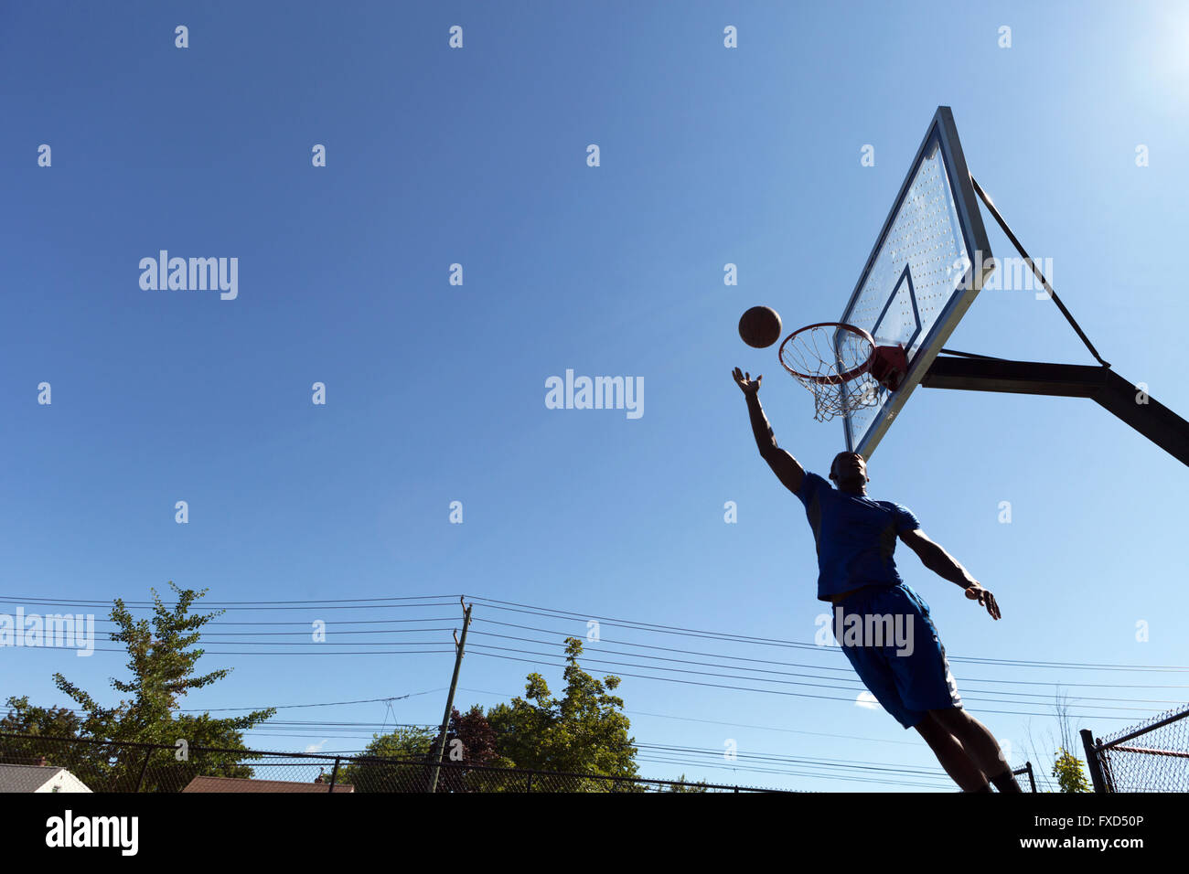Basketball Layup Silhouette Stock Photo