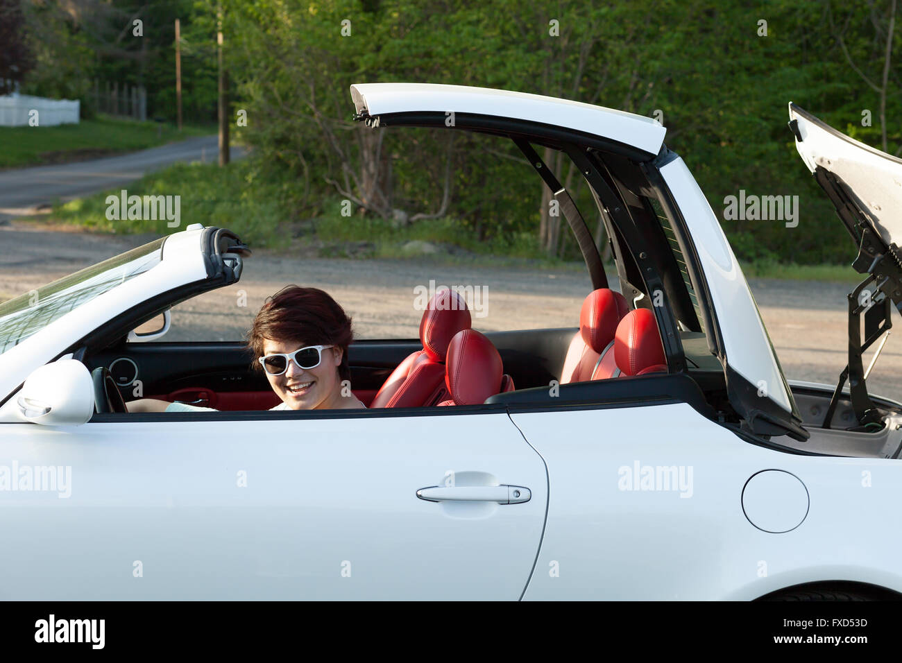 Woman Putting the Top Down Stock Photo