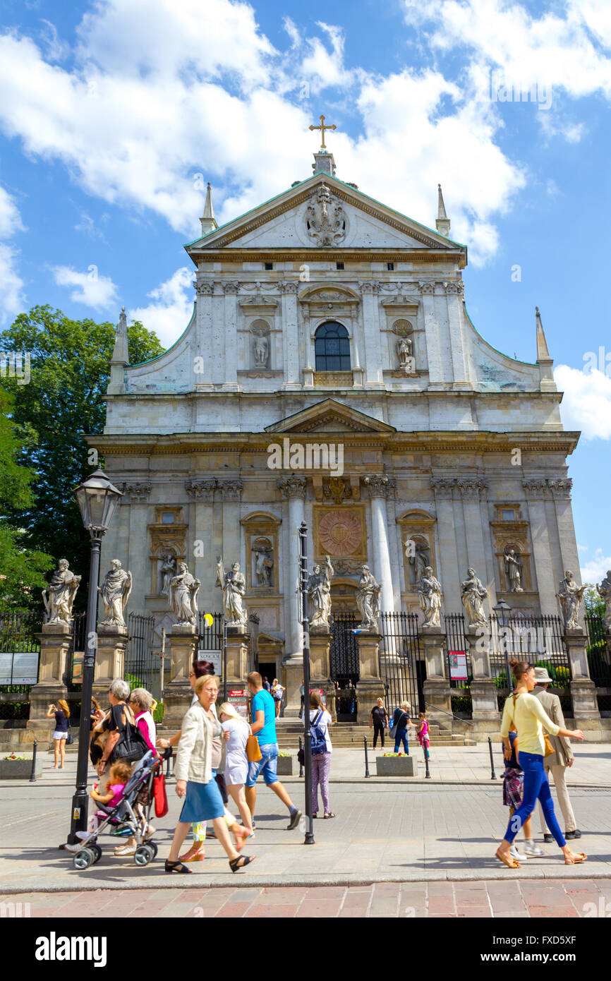 Tourists visiting historical places, St Peter and St Paul church, in Krakow, Poland Stock Photo