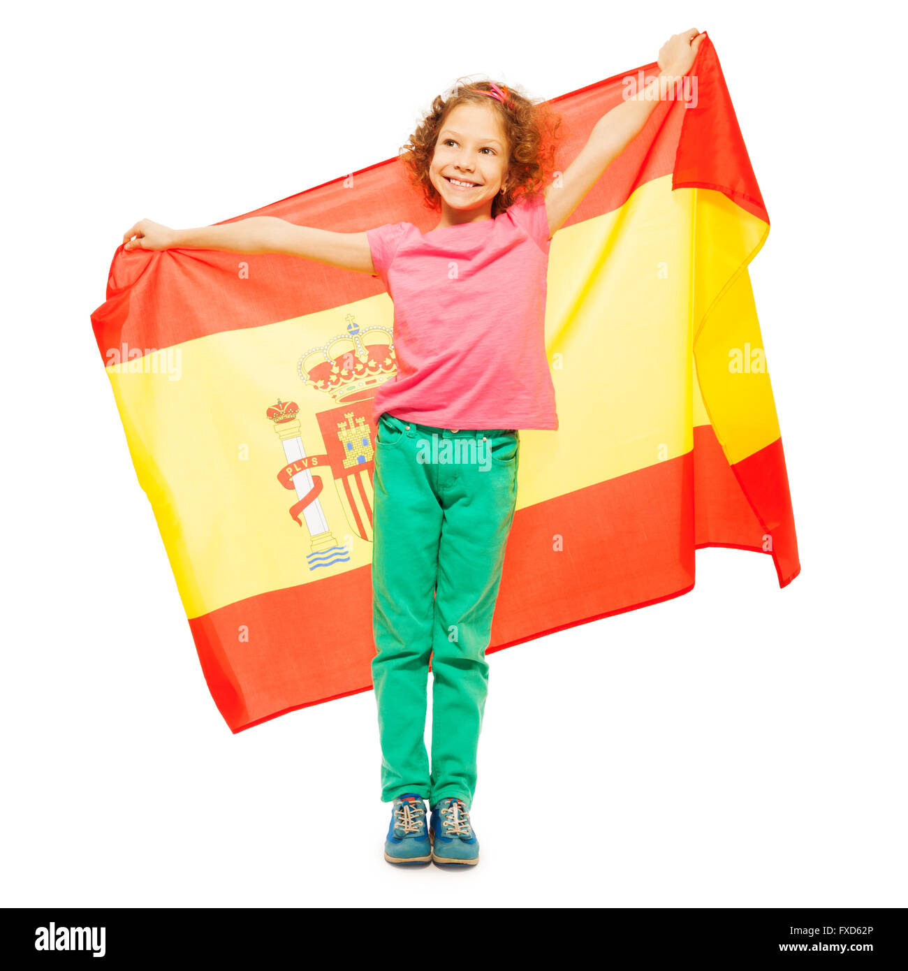 Cute little girl holding Spanish flag behind her Stock Photo