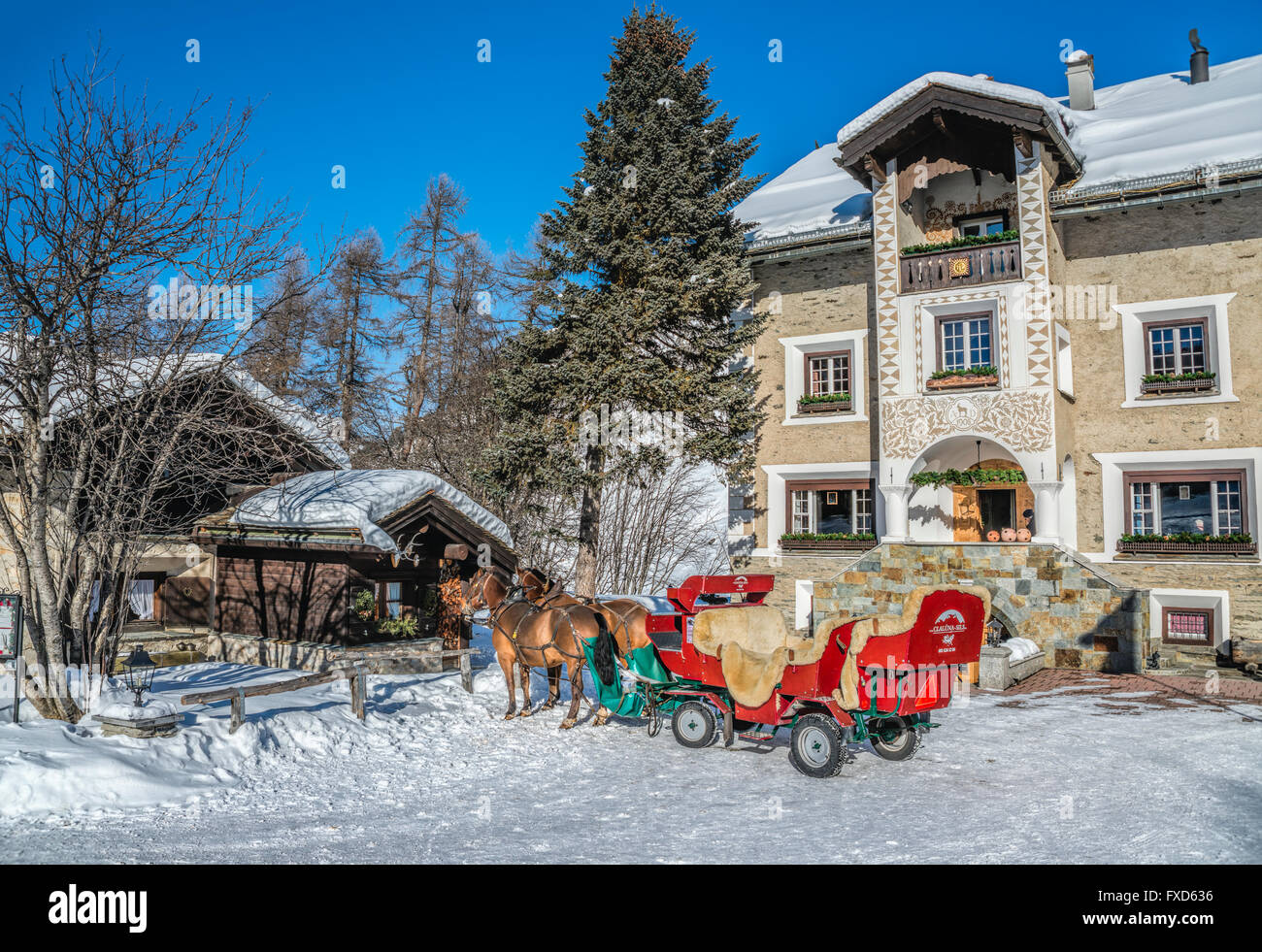 Sleigh in front of the Hotel Sonne, Fex Valley in Winter, Engadine, Grisons, Switzerland Stock Photo