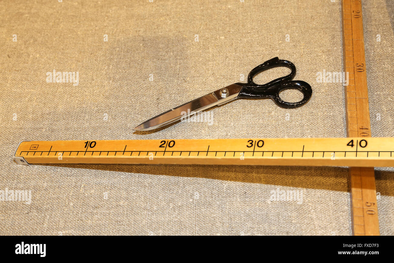 large tailor's scissors with the wooden meter in the Italian artisan