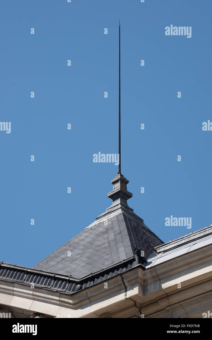 lightning rod isolated on a blue sky on the top of a building Stock Photo