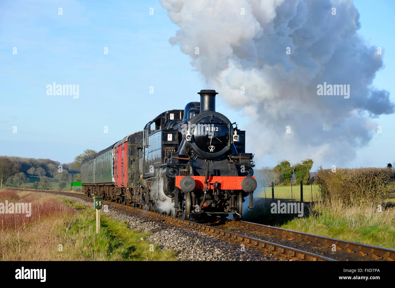 Ivatt Class 2 tank engine with a typical 1950's mixed branch line train during a photo charter on the Mid-Hants Railway. Stock Photo
