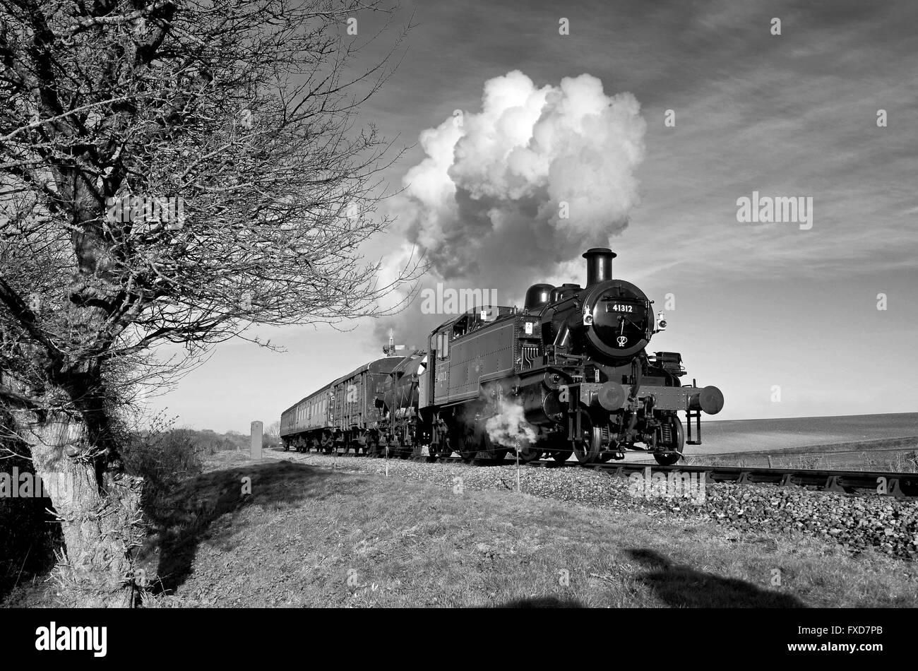 Ivatt Class 2 tank engine with a typical 1950's mixed branch line train during a photo charter on the Mid-Hants Railway. Stock Photo