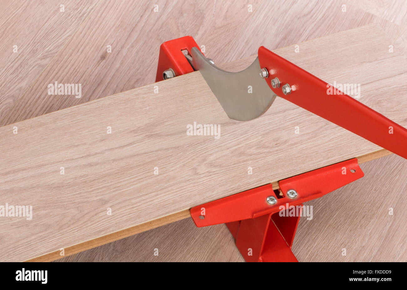 Red Tool For Cutting Laminate On A Laminate Floor Stock