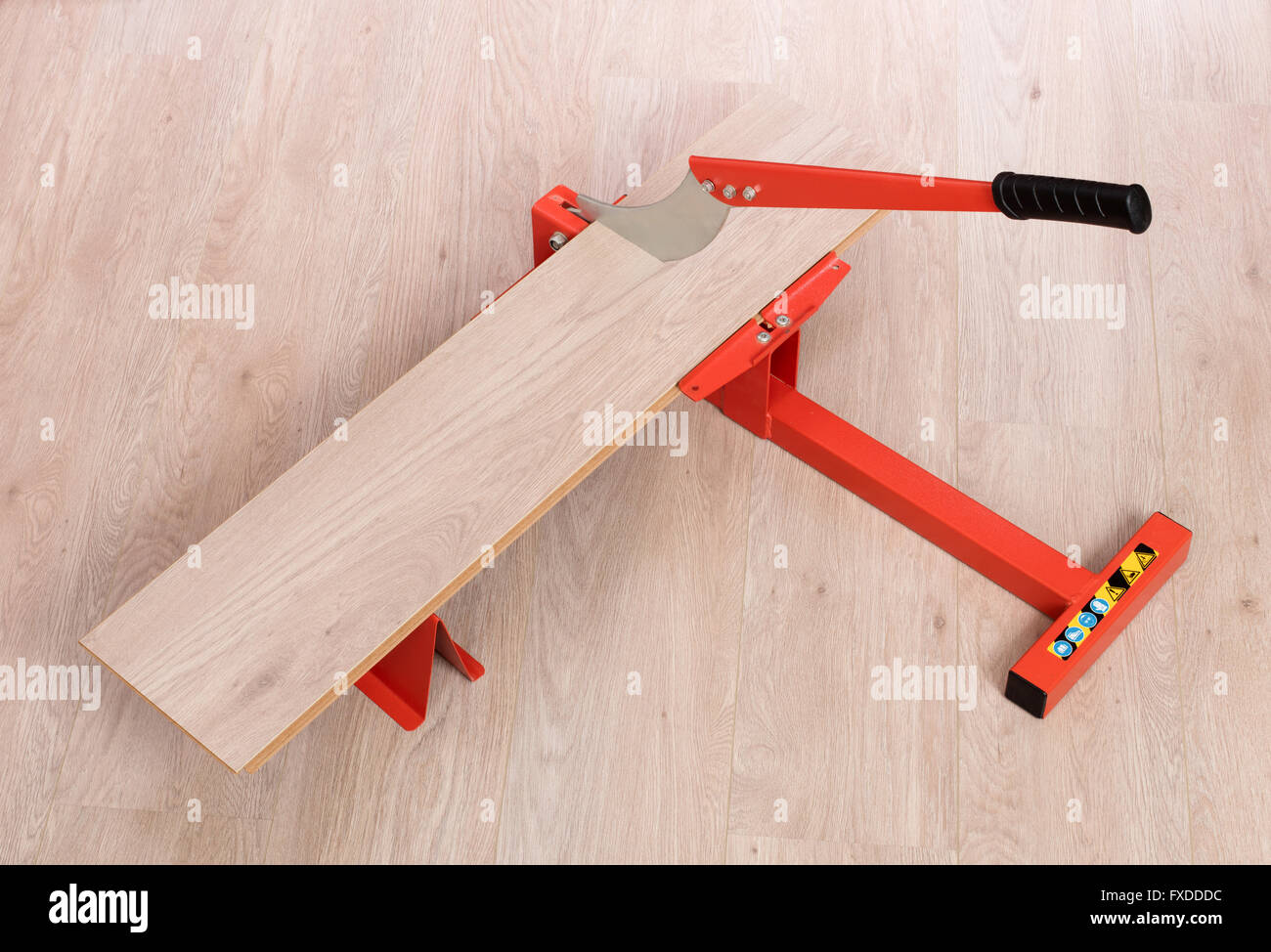 Red Tool For Cutting Laminate On A Laminate Floor Stock Photo