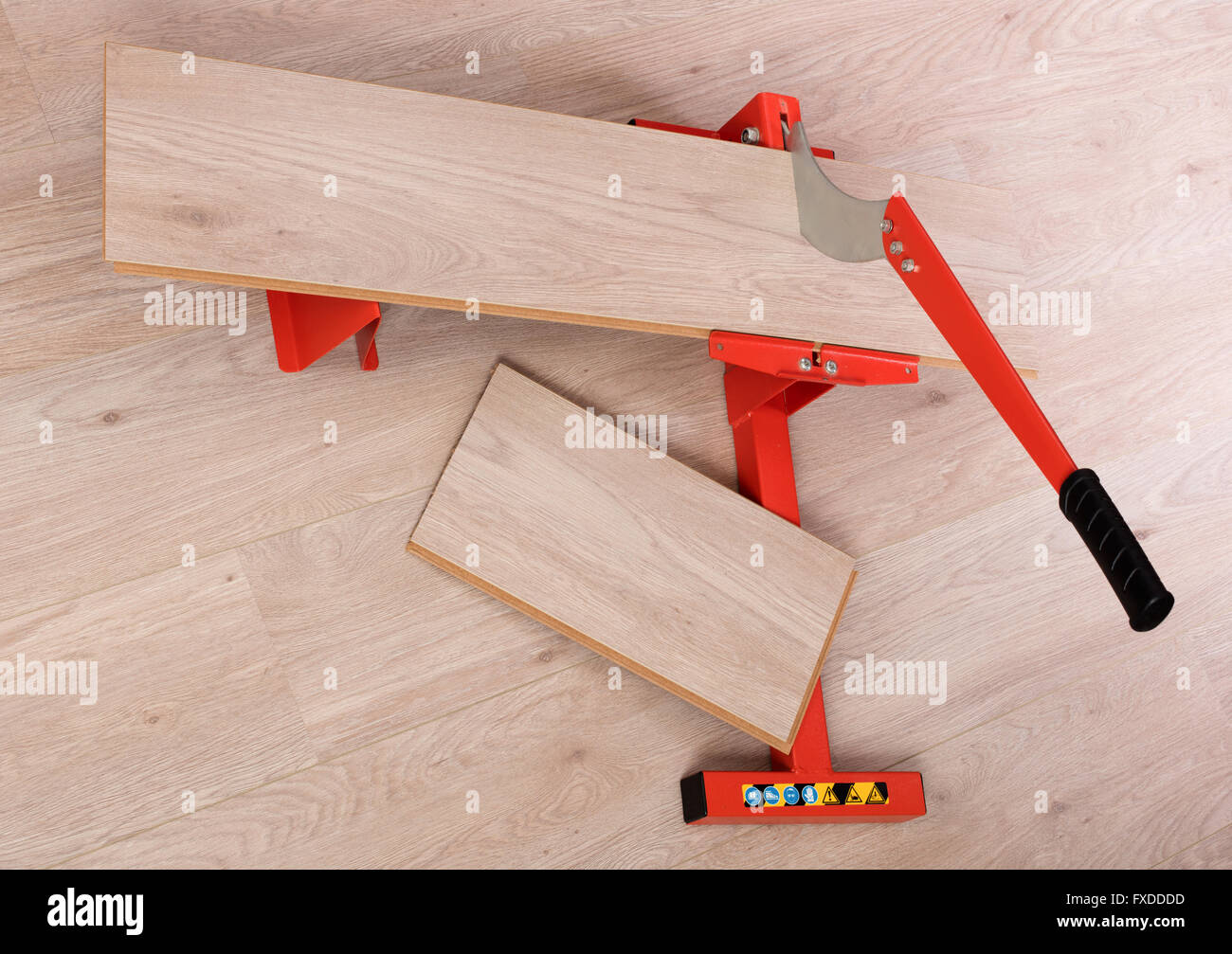 Red Tool For Cutting Laminate On A Laminate Floor Stock