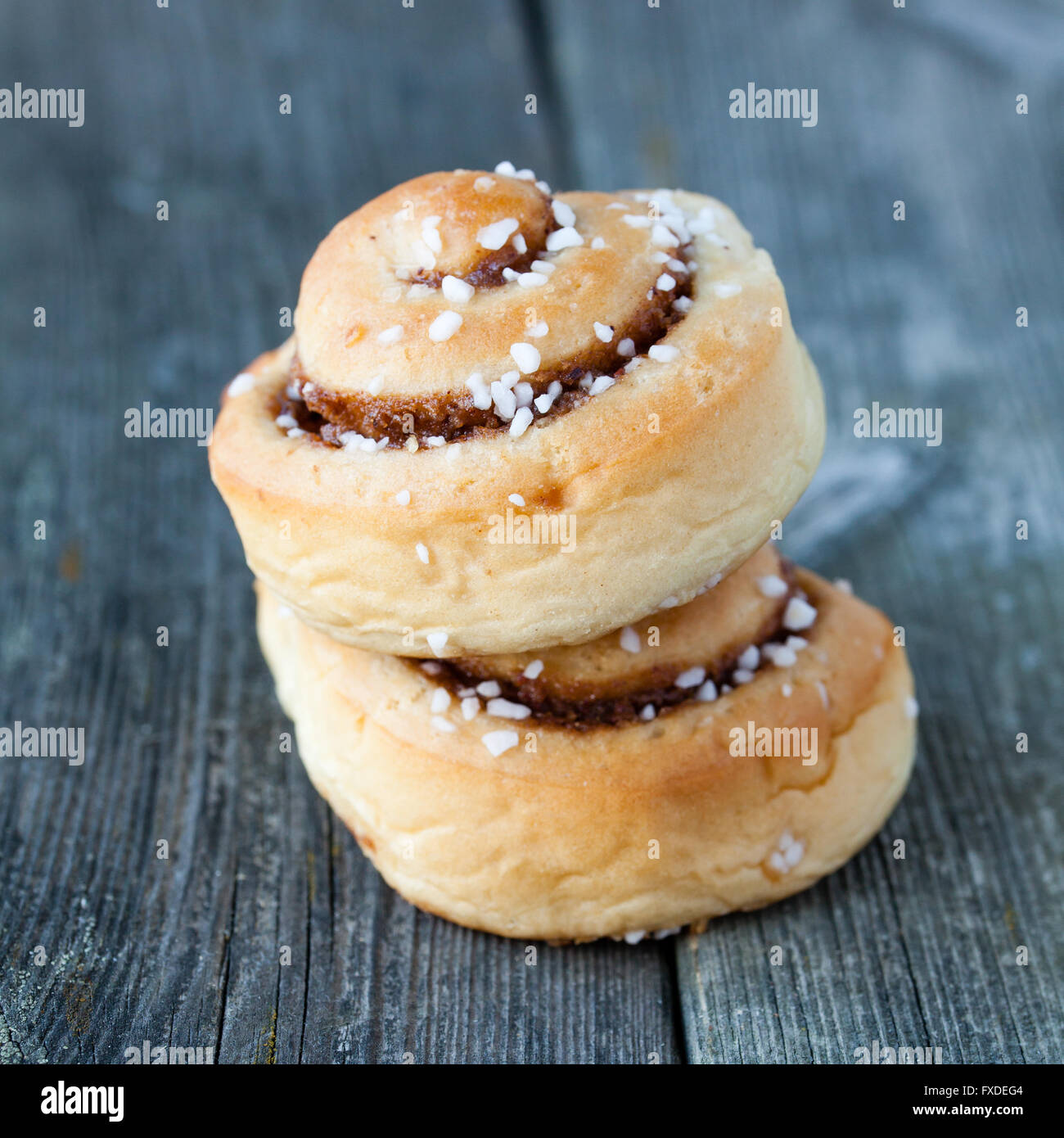 cinnamon buns on dark wooden background Stock Photo