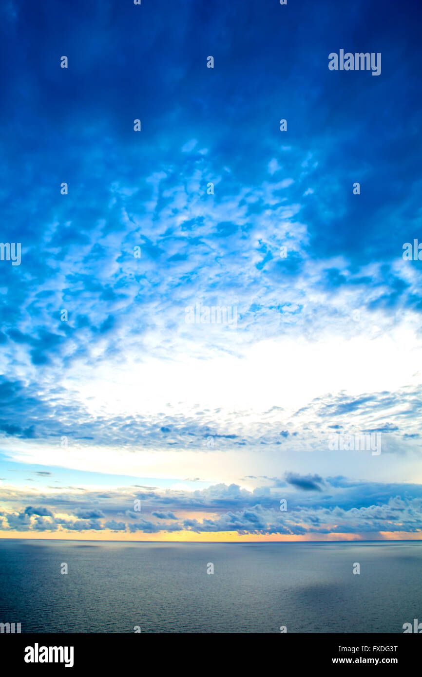 A beautiful cloudy sunset over the ocean Stock Photo - Alamy