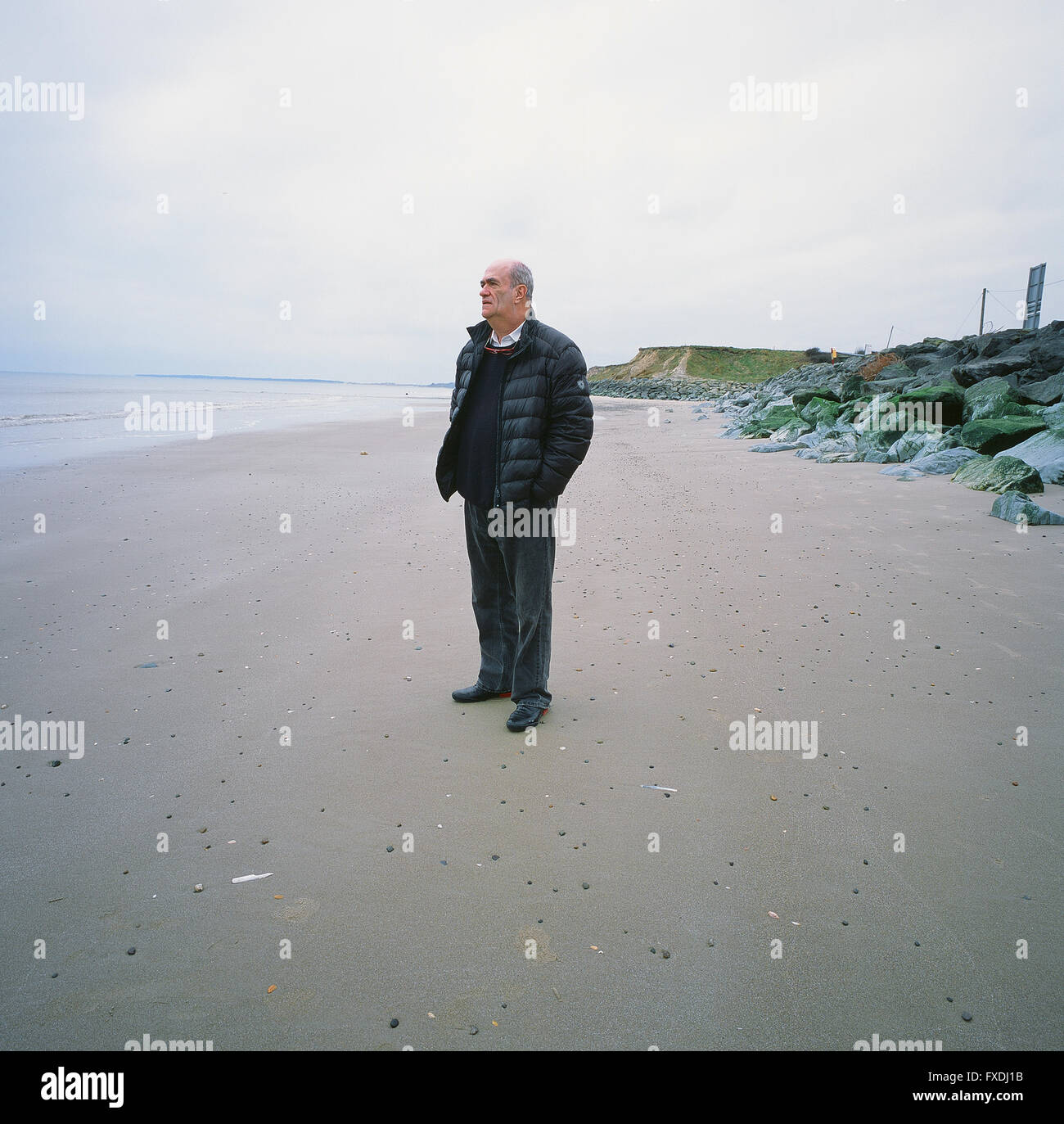 Irish author, Colm Toibin, on the strand at Ballyconnigar, near Enniscorthy, County Wexford. The strand features in many of his novels Stock Photo