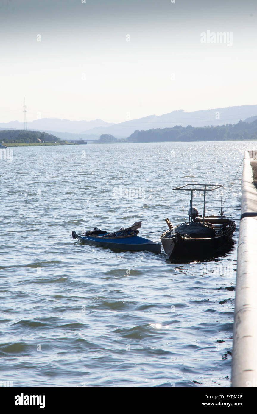 two small boats waiting on the lock Stock Photo