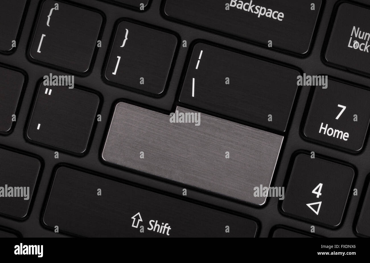 Laptop computer keyboard with blank grey button for text Stock Photo