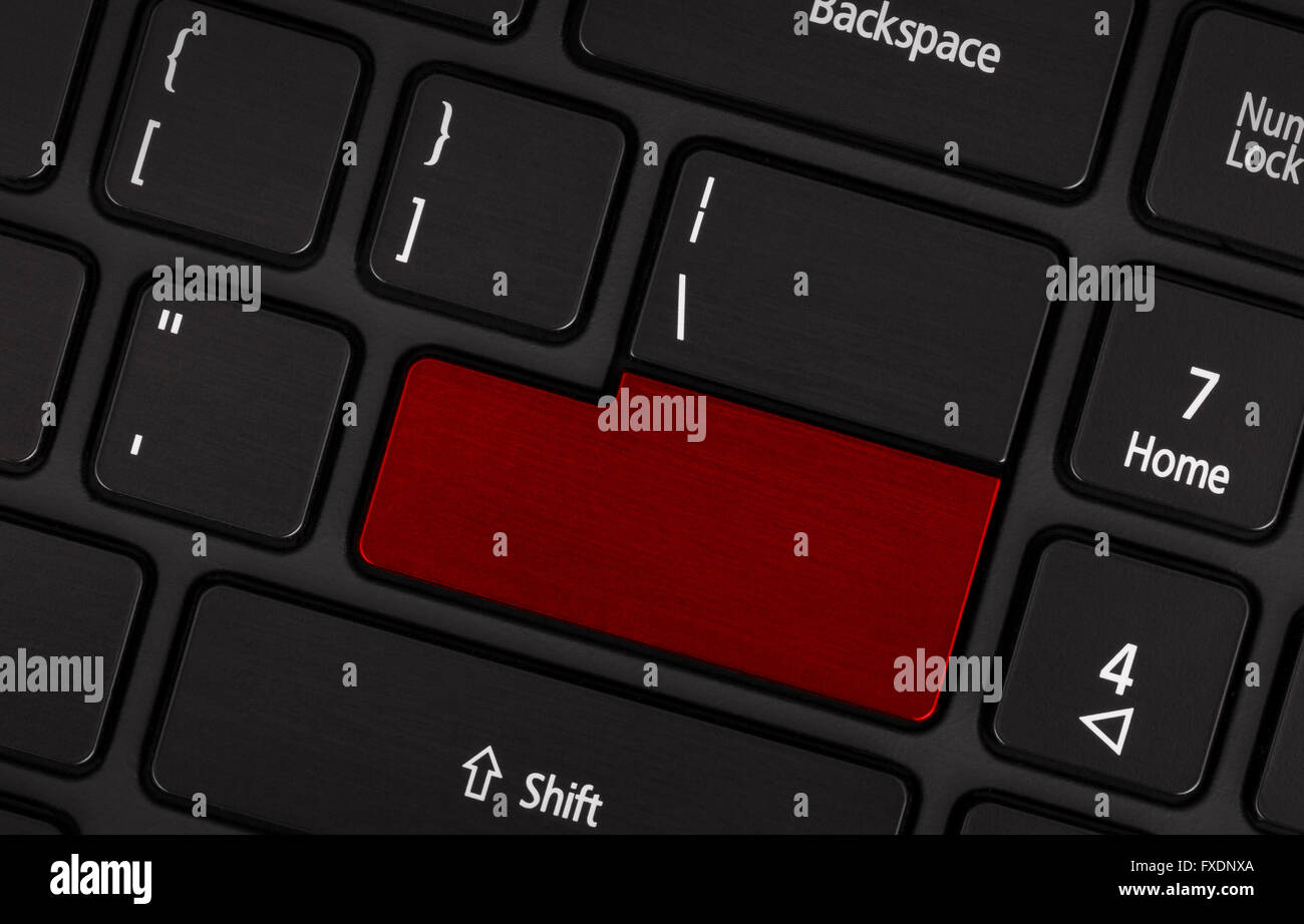 Laptop computer keyboard with blank red button for text Stock Photo