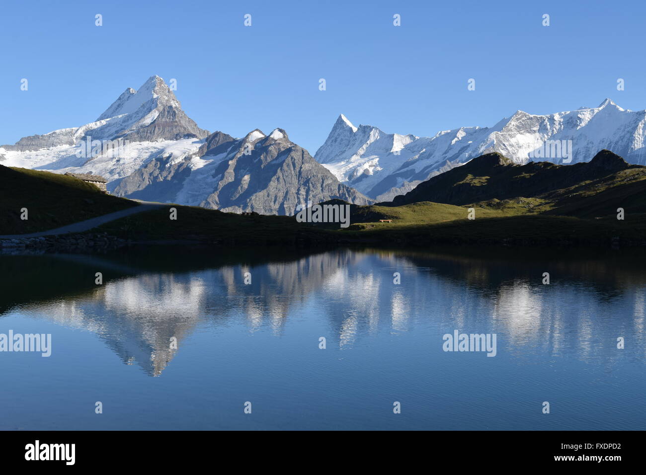 Mountains reflected in Bachalpsee lake Stock Photo