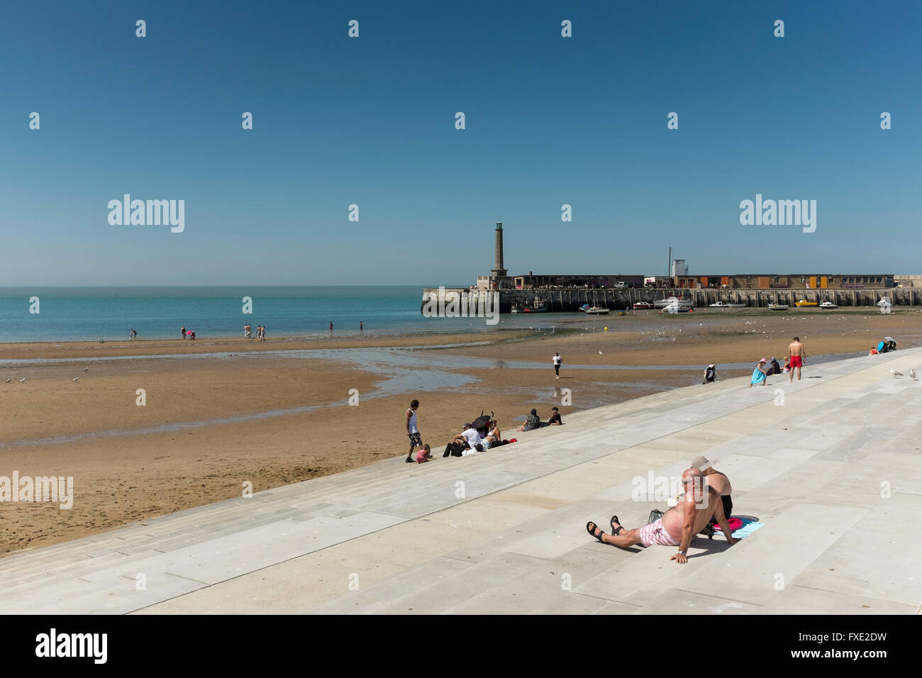Sunbathers at seafront of Margate, Kent, UK Stock Photo