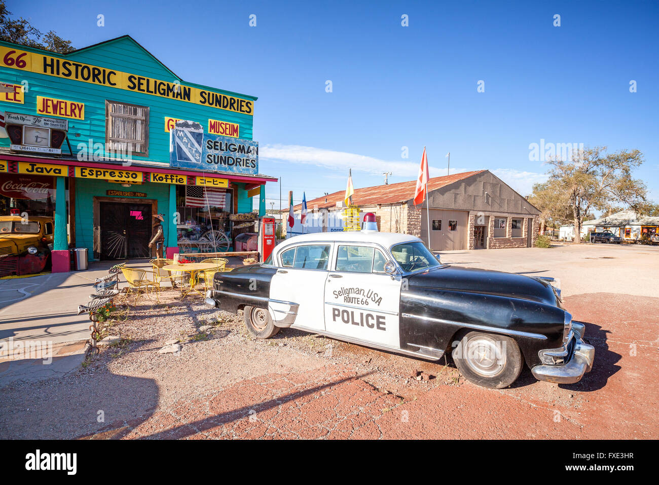 Old police car in front of historic Sundries Building. Stock Photo