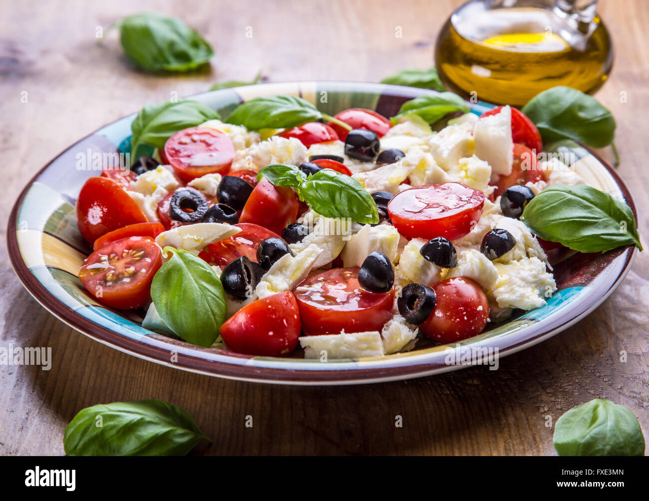 Caprese. Caprese salad. Italian salad. Mediterranean salad. Italian cuisine. Mediterranean cuisine. Tomato mozzarella basil leav Stock Photo