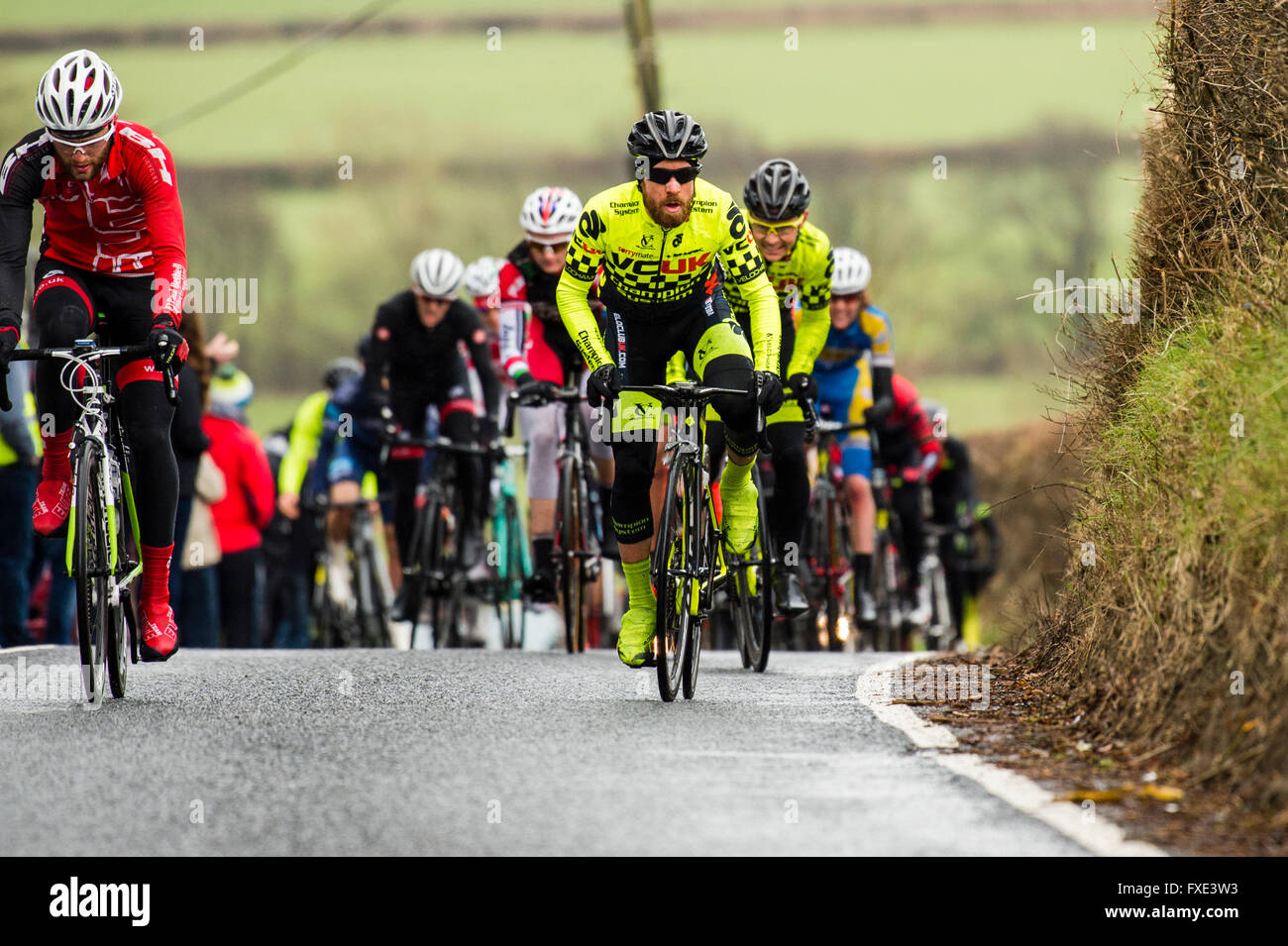 Cyclists competing in the annual 'The Tour of the Mining Valleys' cycling road race on the narrow country roads near Aberystwyth, Ceredigion Wales UK Stock Photo