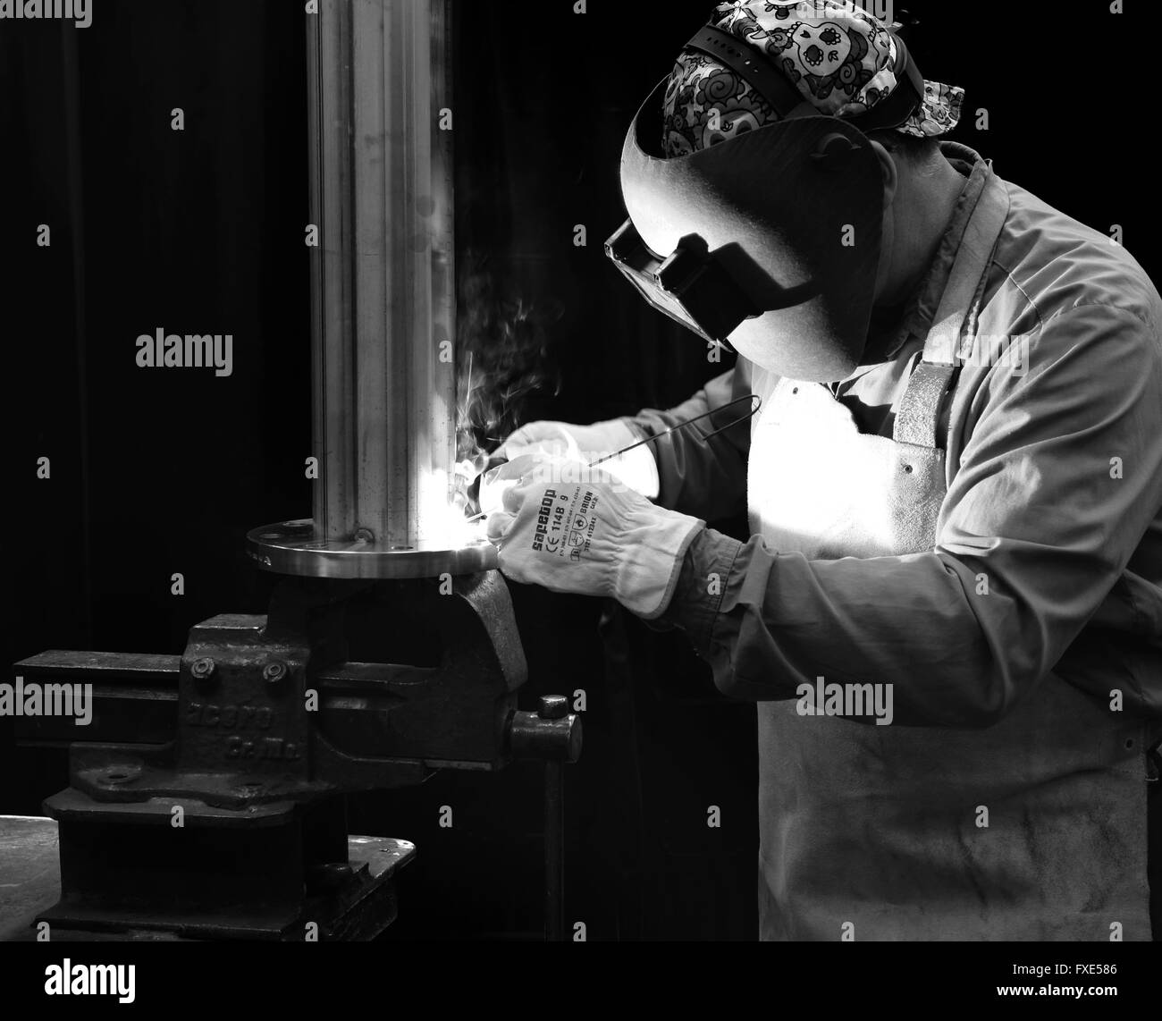 Welder, solderer, welding, soldering. Black and white. Stock Photo