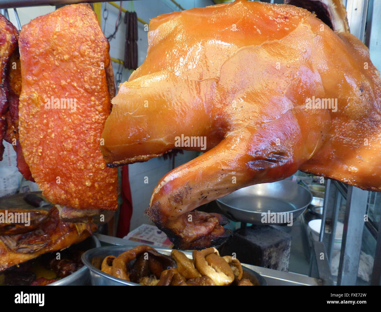 Pieces of pork hanging off the hook Stock Photo Alamy