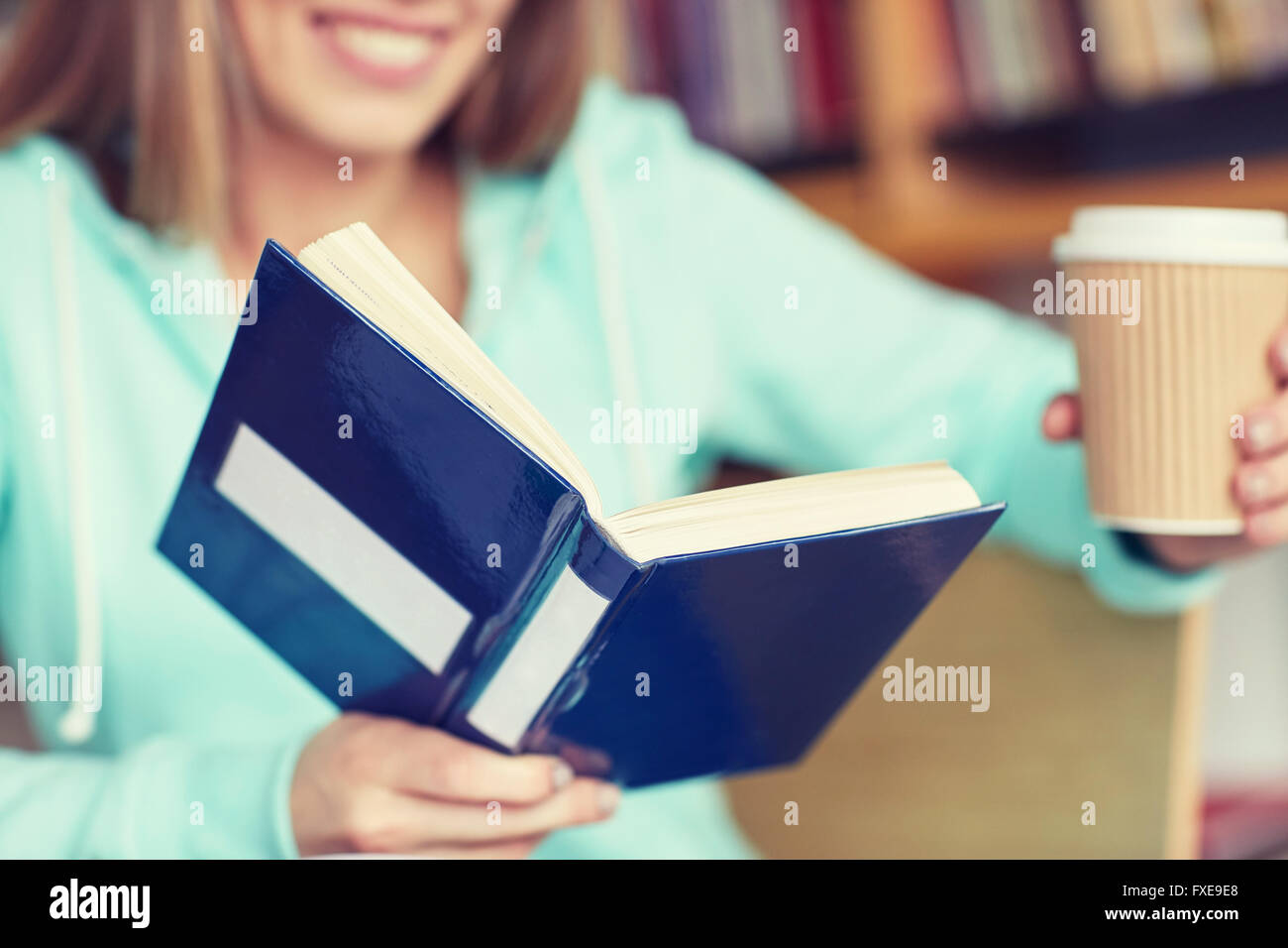 close up of student reading book at school Stock Photo - Alamy